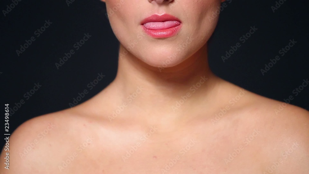Part of beautiful woman head showing tongue Part of beautiful woman head showing tongue