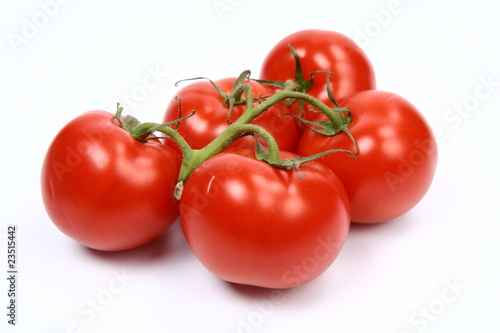 Bunch of tomatoes on white background © teine