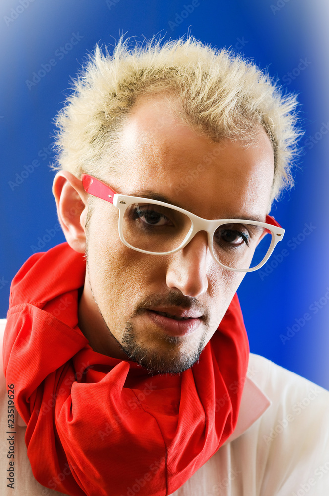 Fototapeta premium Man with red scarf against coloured background