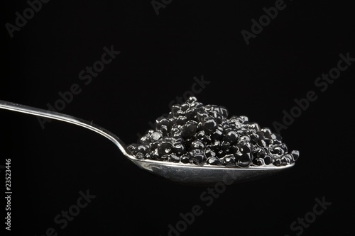 The full spoon of black caviar