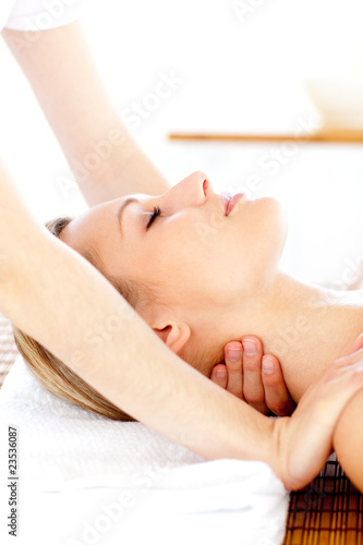 Portrait of a young woman having a massage