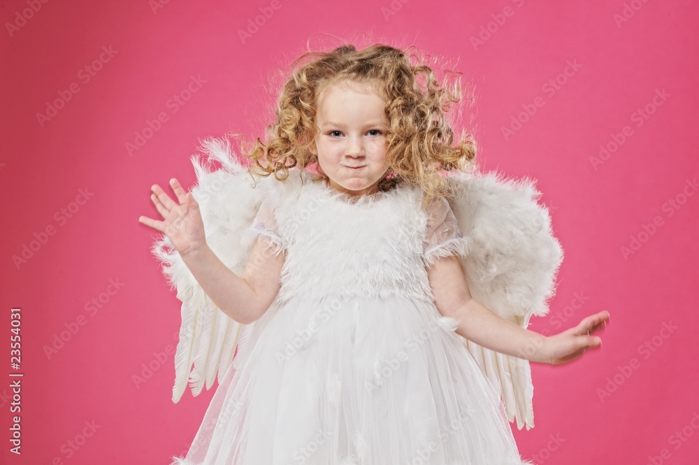 Beautiful little angel girl isolated on pink background Beautiful little angel girl isolated on pink background
