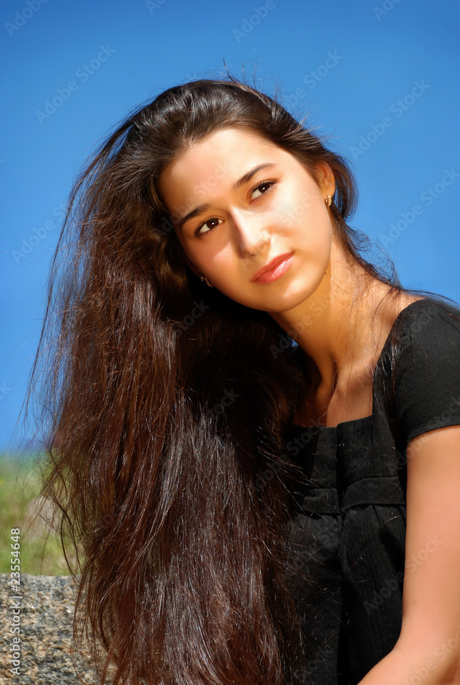 Fototapeta premium Charming girl in sunlight.