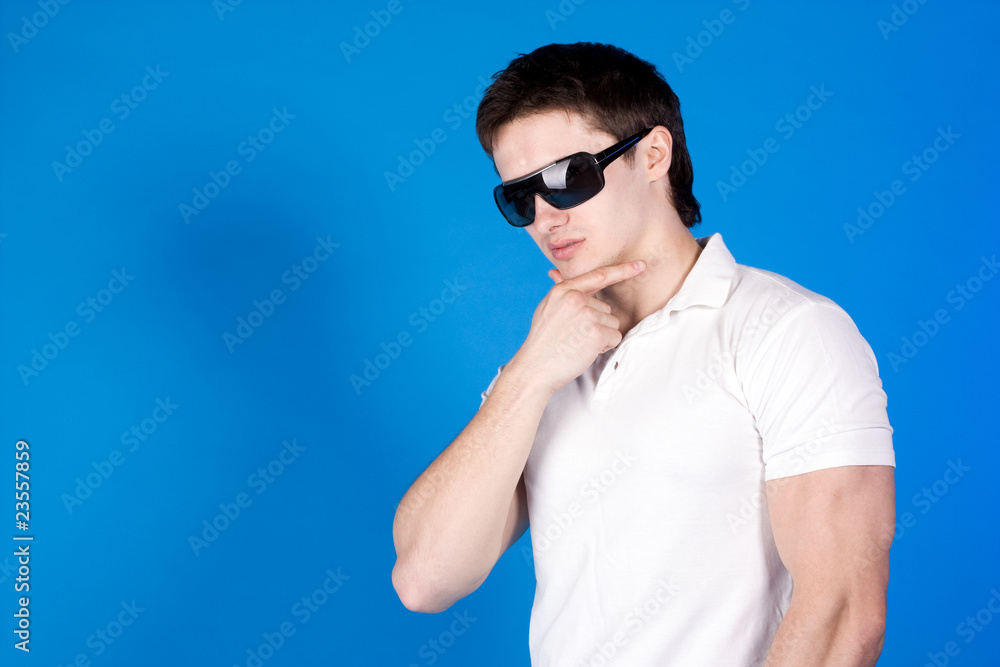 Confident guy with the glasses in the studio Confident guy with the glasses in the studio