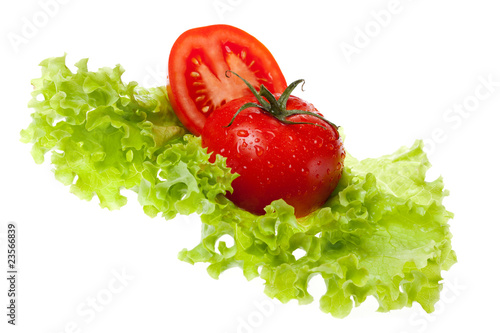 cut tomato on sheet of the salad