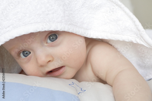 baby under bath towel