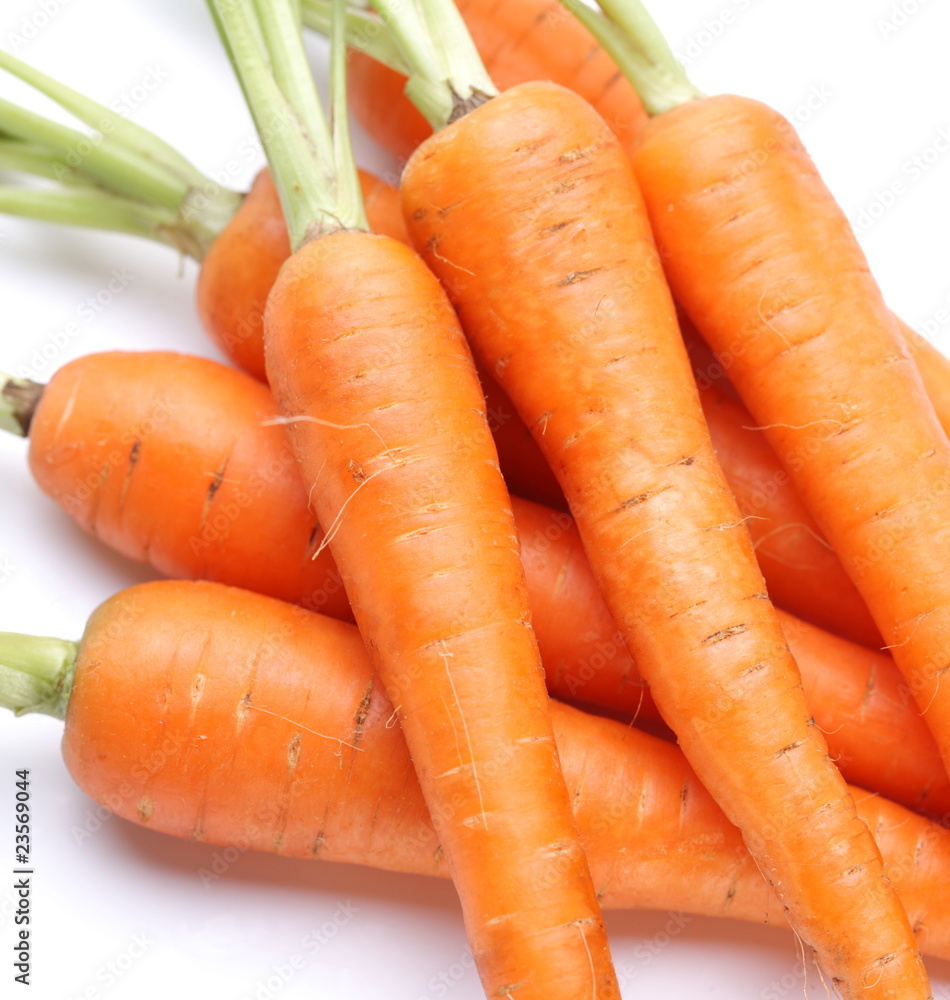 Ripe fresh carrots on a white background. Ripe fresh carrots on a white background.