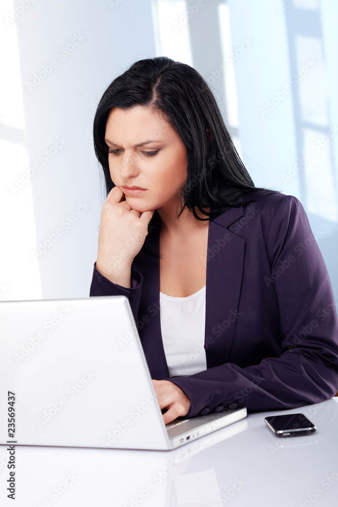 Business woman with laptop, perplex Business woman with laptop, perplex