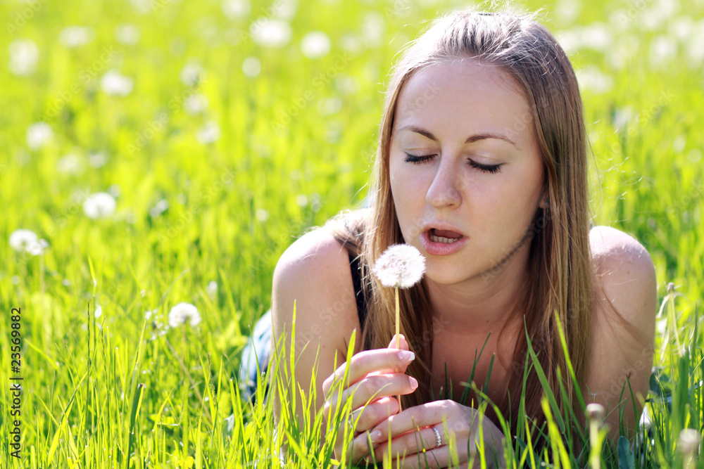 Dandelion - The girl blows on a dandelion Dandelion - The girl blows on a dandelion