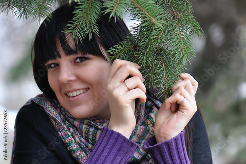 The girl under a fur-tree