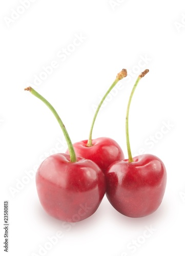 Three juicy cherry over white.