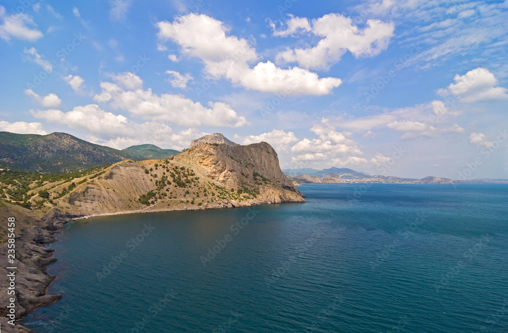 Sea, mountains and blue sky