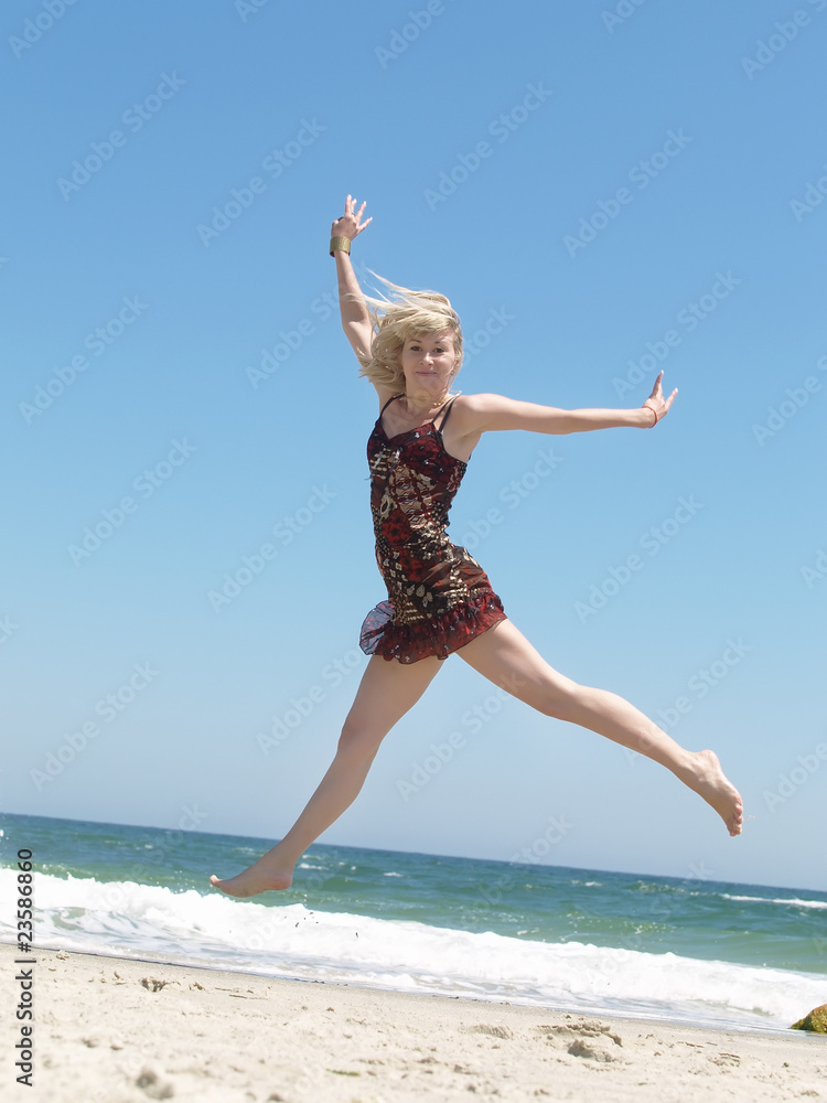 Young blonde woman vacationing at the beach Young blonde woman vacationing at the beach