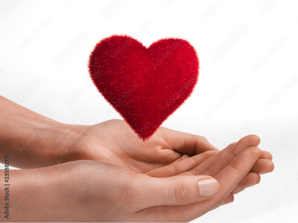 Obraz premium Floating red heart in open hands