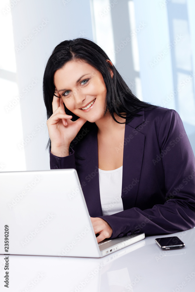 smiling business woman in the office smiling business woman in the office