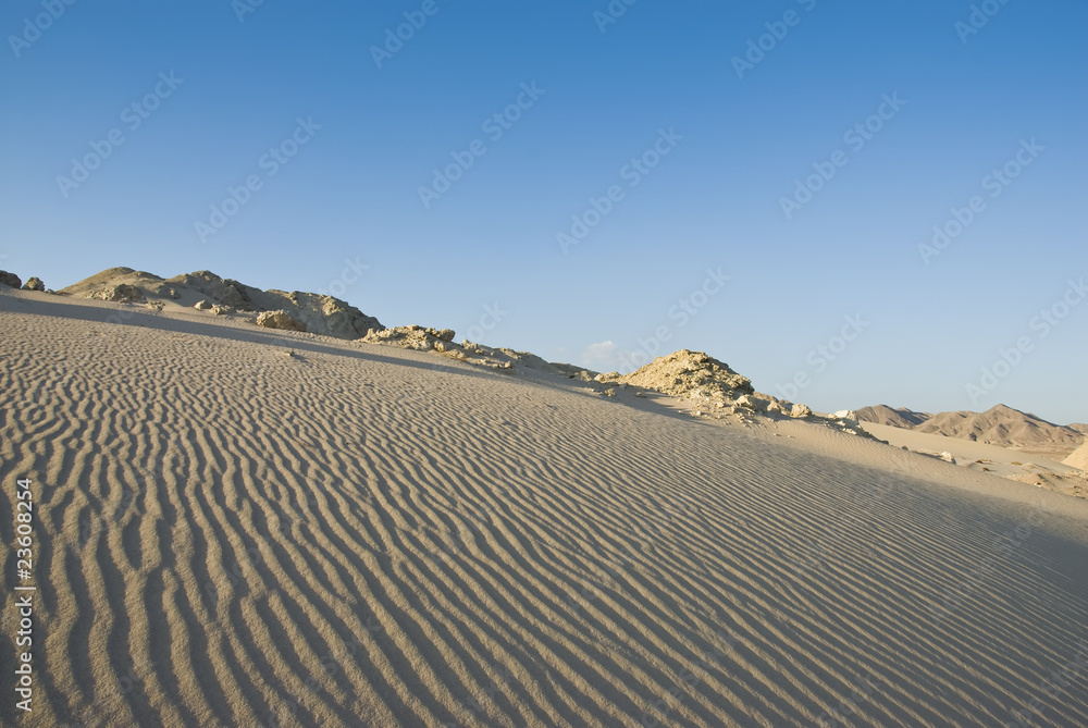 Sand dune with natural ripples.