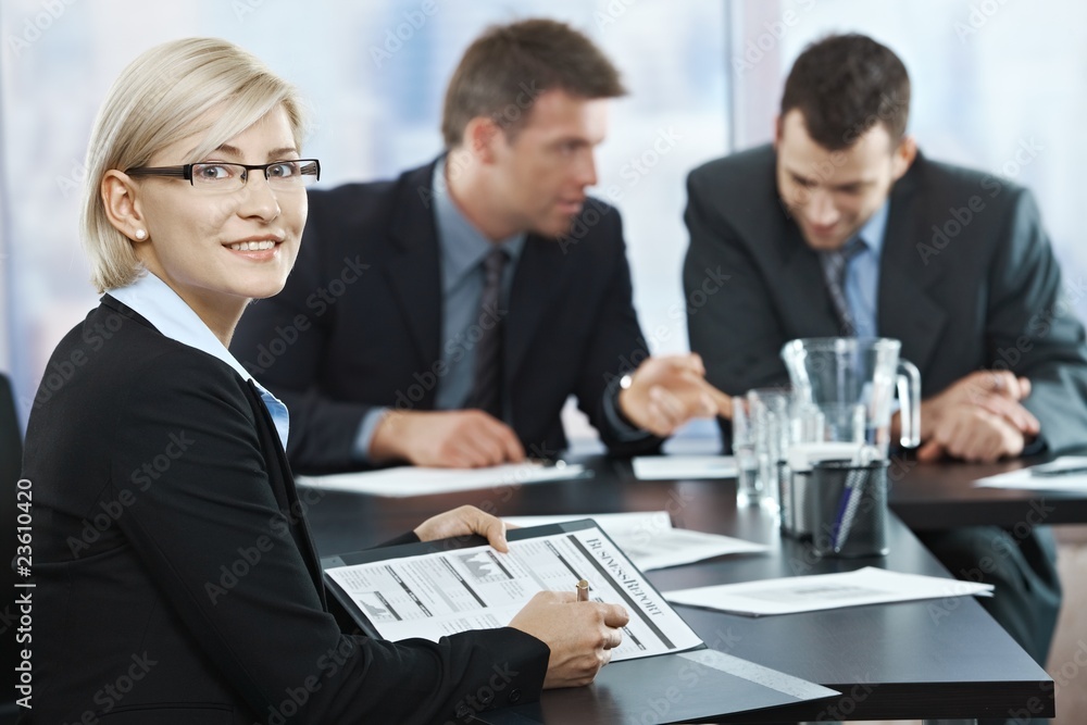 Smiling businesswoman at meeting Smiling businesswoman at meeting