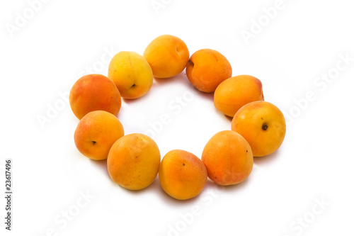 Ripe apricots on white background