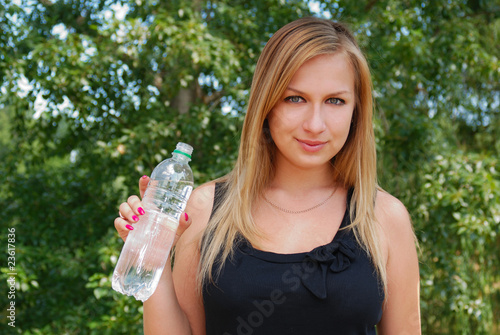 Teenage girl with bottle