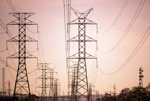 High voltage electric powerlines at sunset
