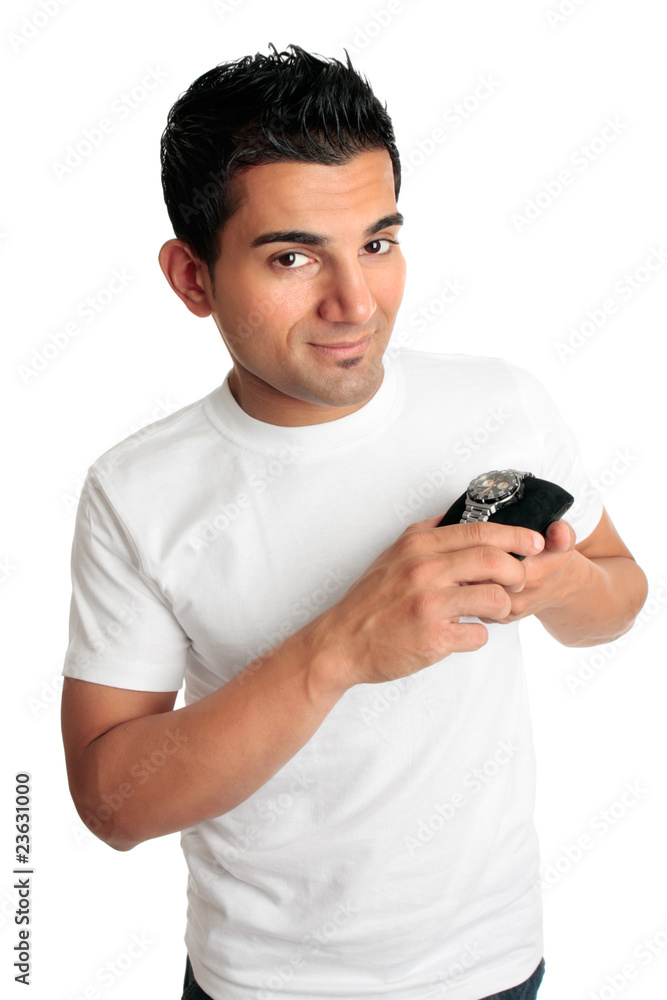 Smiling man showing a watch Smiling man showing a watch