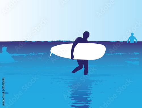 surfer walking in the ocean