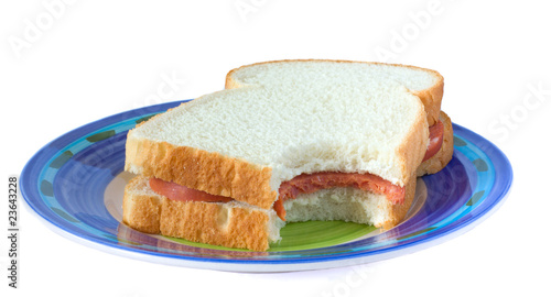 sandwich with sausage 	on a plate