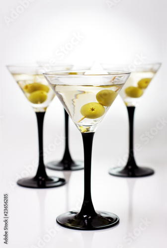 Martini with olives on a white background