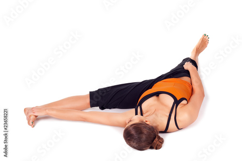Fit Woman Practicing Reclining Big Toe Yoga Pose