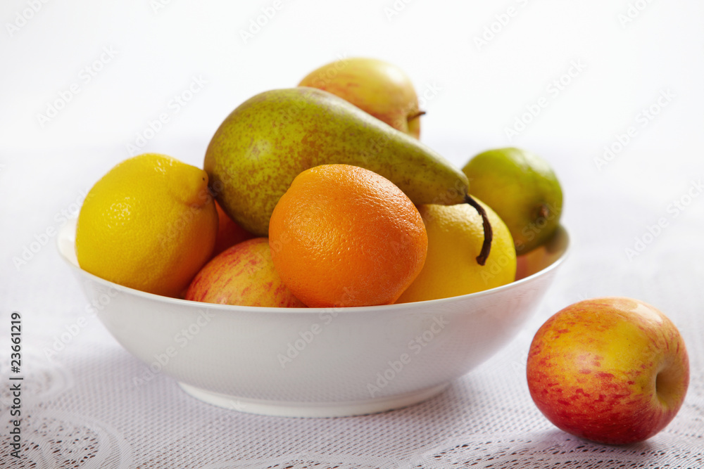 fresh fruits in white bowl