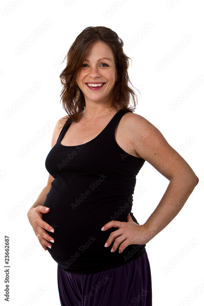 Young pregnant woman in a studio setting isolated over white. Young pregnant woman in a studio setting isolated over white.