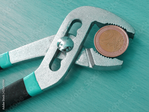 one euro coin under pressure
