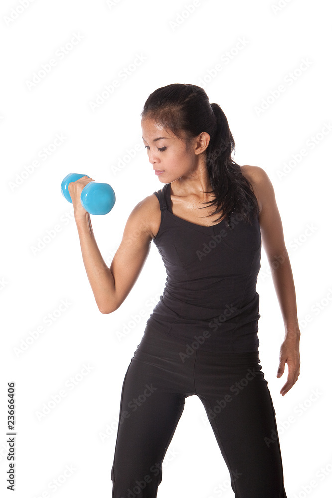 Female fitness trainer pumping dumbell , working on her arm. Female fitness trainer pumping dumbell , working on her arm.