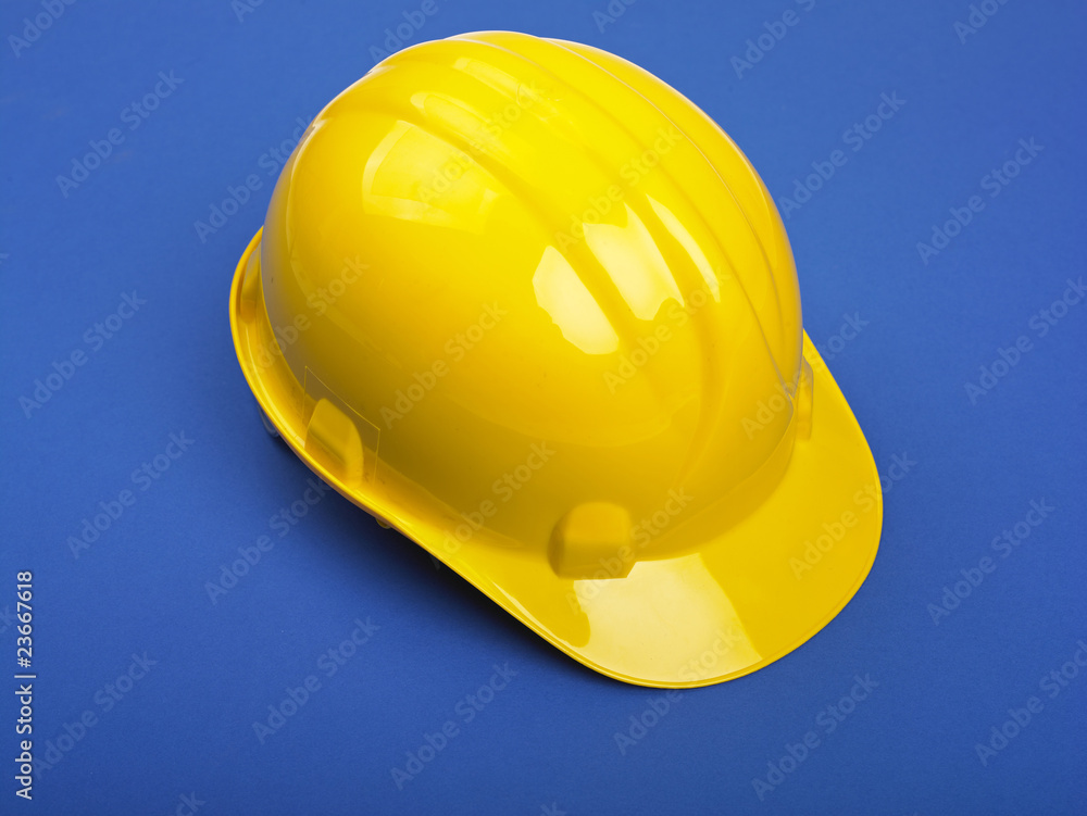 Fototapeta premium Yello Hardhat On Blue