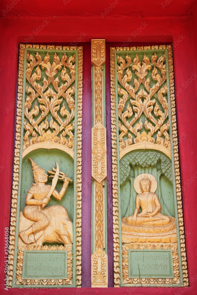 Fototapeta premium buddhist art on window of temple, Wat Ku Ka Singh, Roi-Et