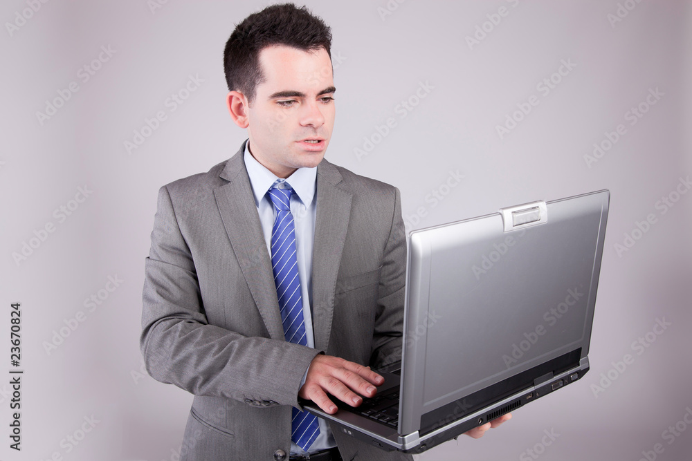 Young business man working with laptop Young business man working with laptop