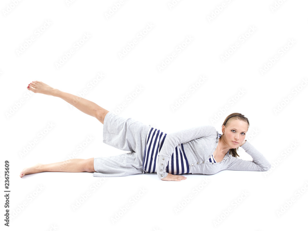 Young woman exercising pilates