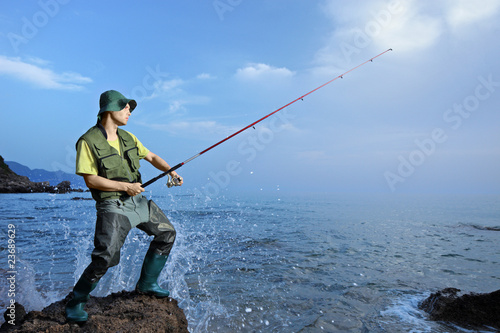 A fisherman fishing at the Ionian sea