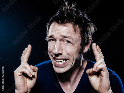 Funny Man Portrait with crossed fingers