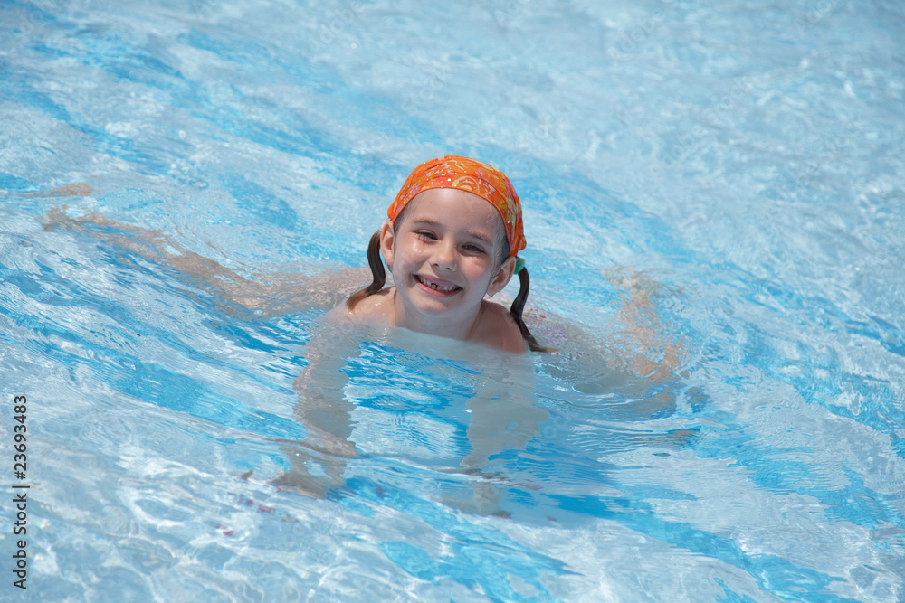 little girl in pool. blue water