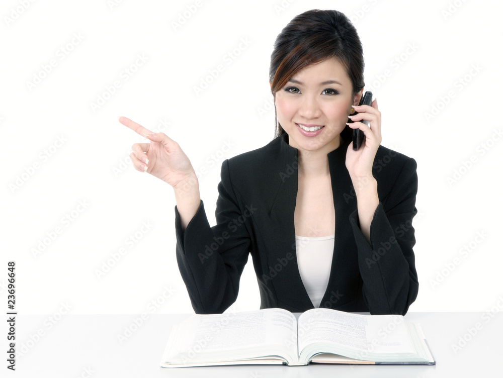 Happy young businesswoman talking on cellphone Happy young businesswoman talking on cellphone