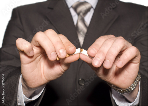 No smoking. A hand crushing cigarettes © svand