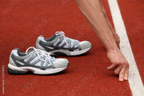 Sports shoes and line of start