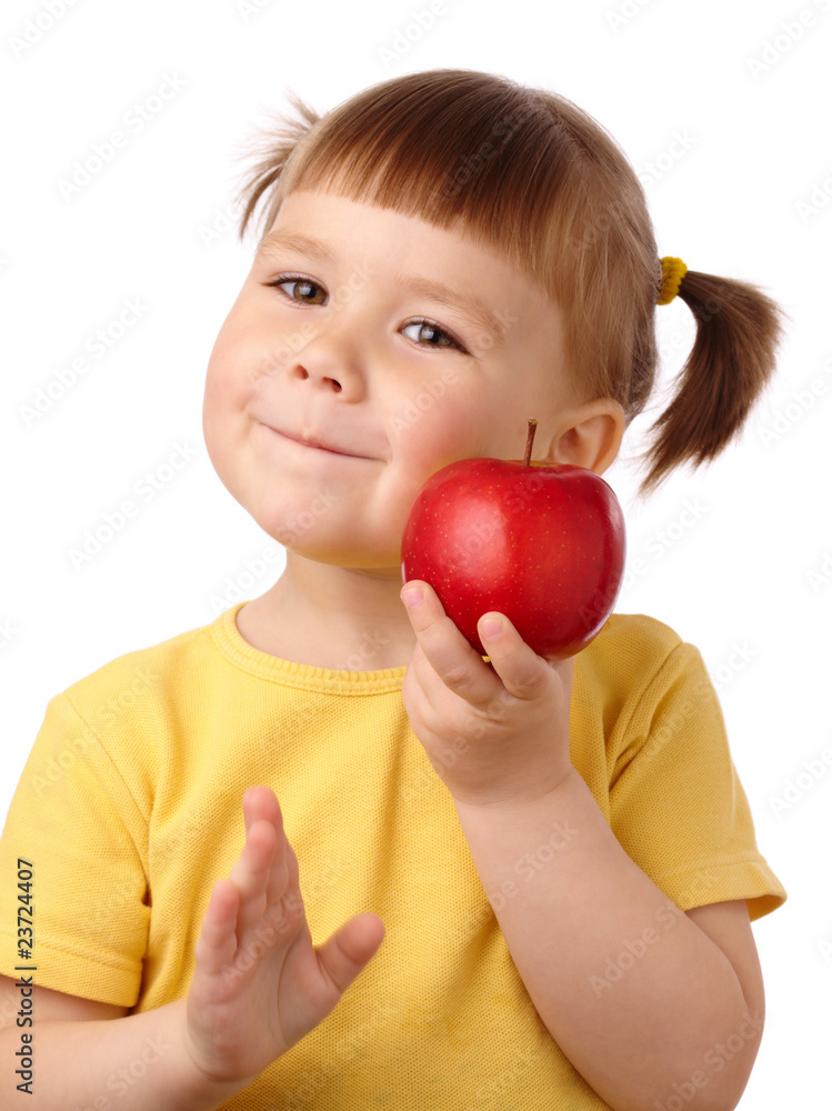 Cute child is going to bite an apple Cute child is going to bite an apple