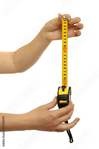 tape-measure in a beautiful female hands