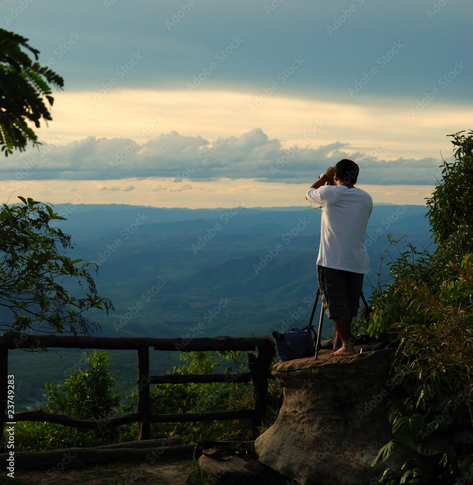 Naklejka premium A sunset photographer