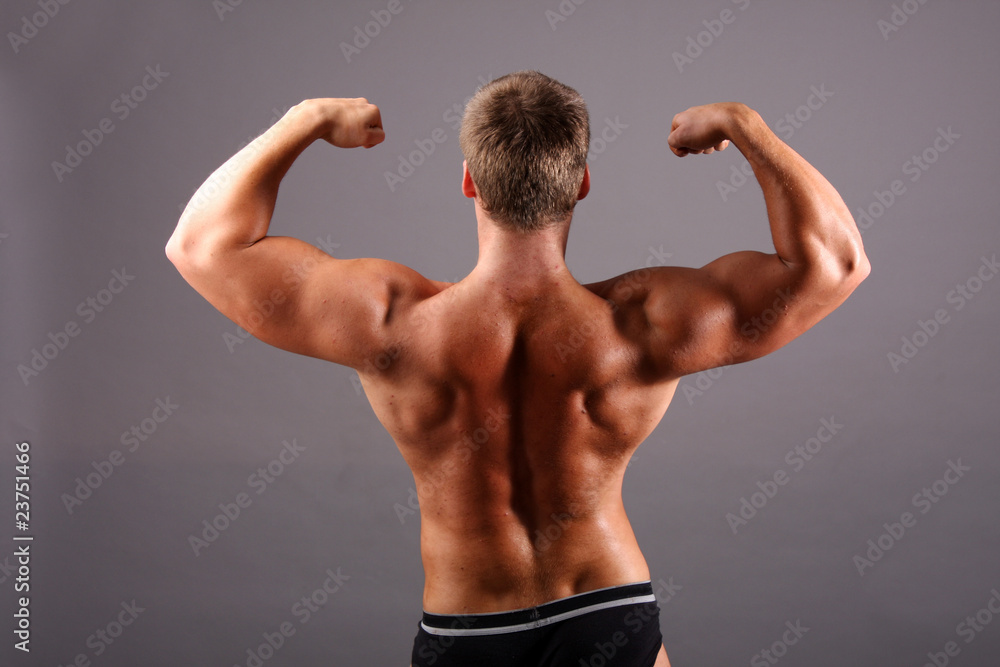 bodybuilder showing his muscles bodybuilder showing his muscles