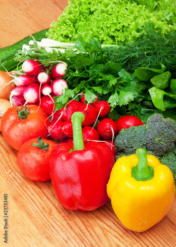 mix of fresh vegetables on wooden table