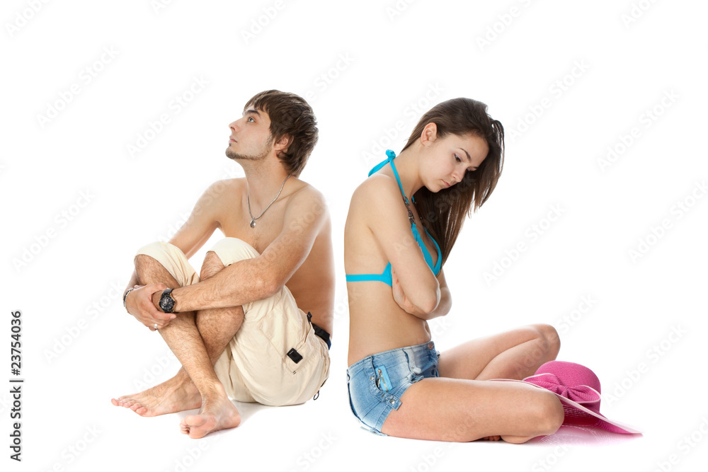 young couple in beach clothes quarreled