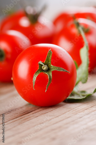Cherry tomatoes on the wood background